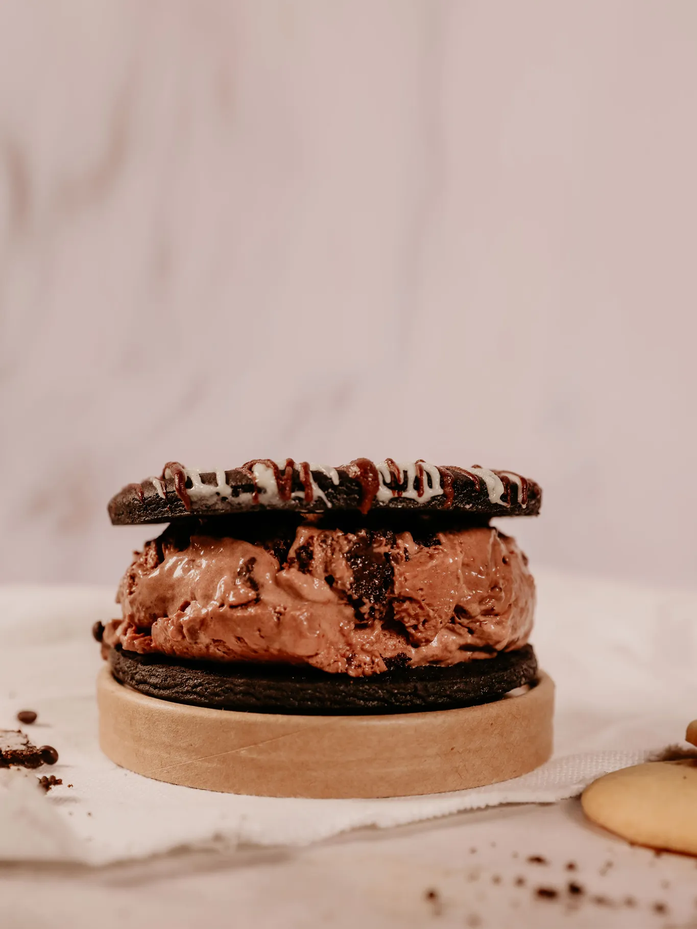 Cookies and Cream Triple Choc Ice-cream sandwich on table
